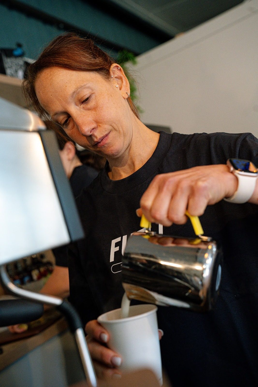 Barista pouring a coffee at FUELL Coffee